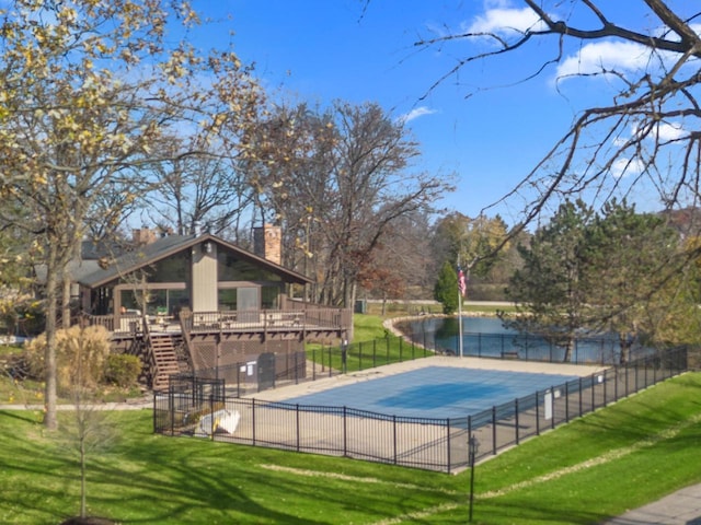 view of pool featuring a deck and a yard