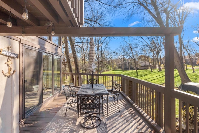 wooden terrace with a yard