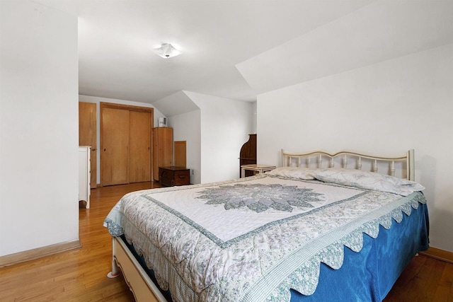 bedroom with hardwood / wood-style flooring