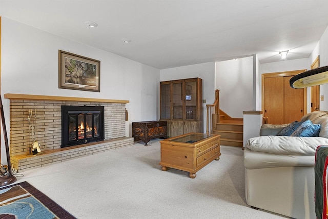 carpeted living room featuring a fireplace