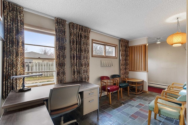 office with plenty of natural light, a textured ceiling, and a baseboard heating unit