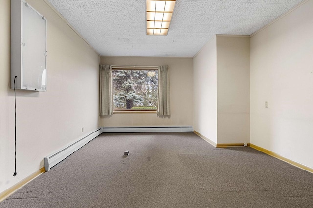 carpeted empty room featuring a baseboard heating unit