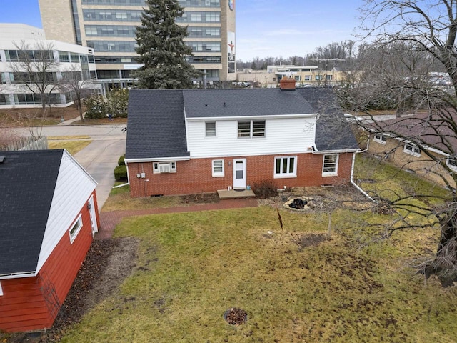 rear view of house with a lawn