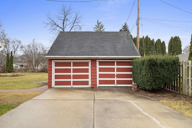 garage featuring a lawn