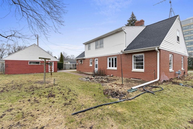 back of house featuring a yard