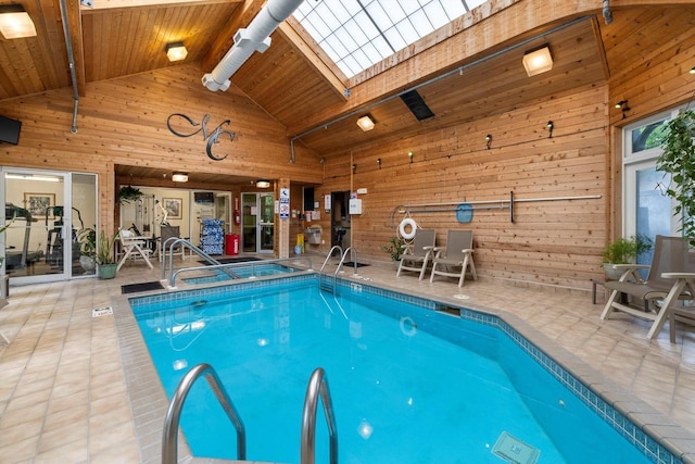 view of swimming pool featuring an indoor hot tub and a patio area