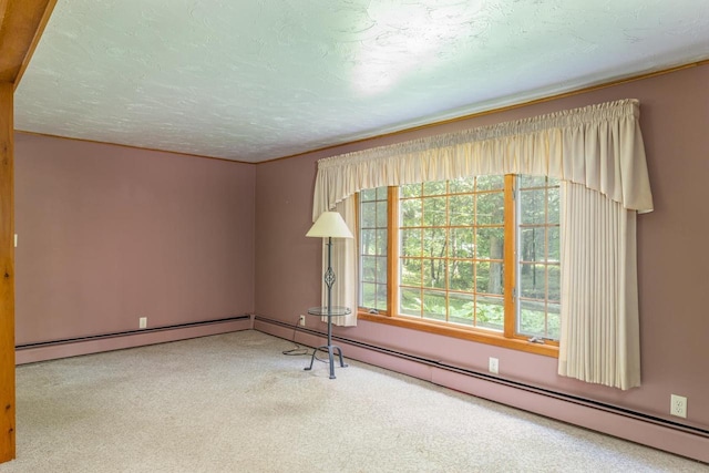 unfurnished room featuring baseboard heating, carpet, and a textured ceiling