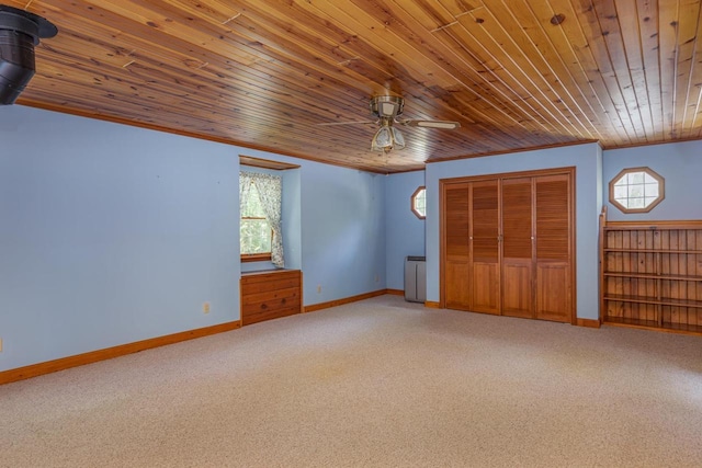 unfurnished bedroom with carpet, wooden ceiling, and ornamental molding