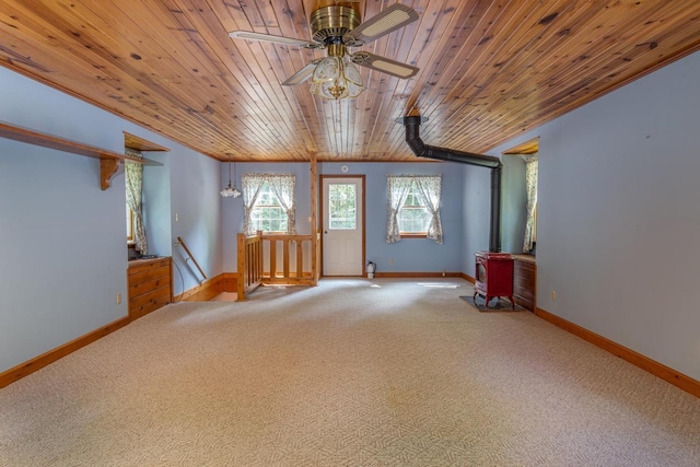 carpeted spare room with lofted ceiling, ceiling fan, and wooden ceiling