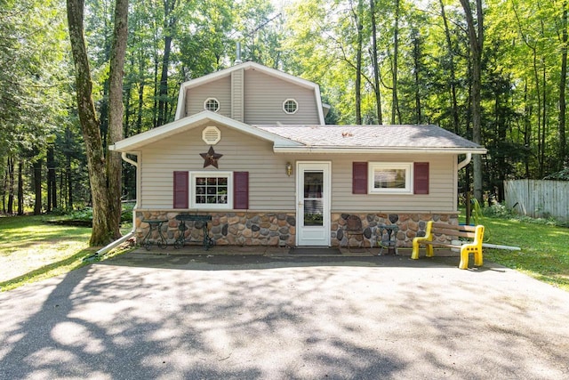 front facade with a front yard