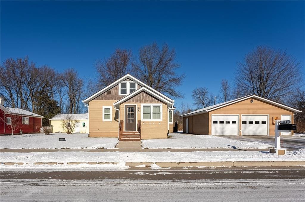 view of front facade with a garage and an outdoor structure