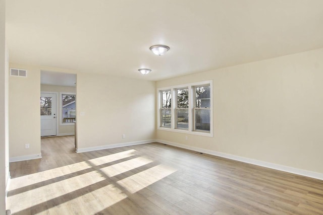 spare room with light wood-type flooring