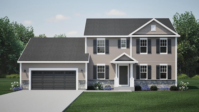 view of front of property with a front yard and a garage