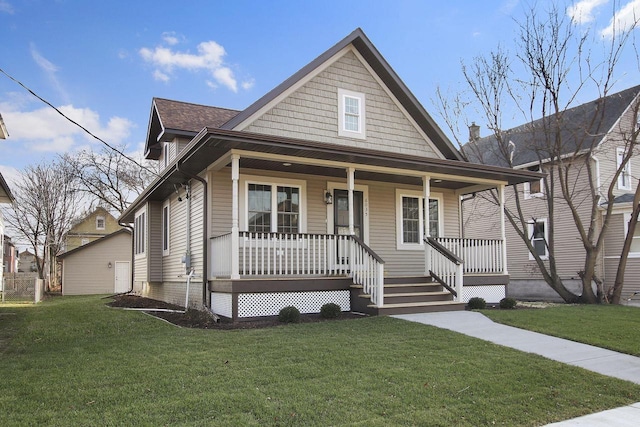 view of front facade with a front yard and a porch