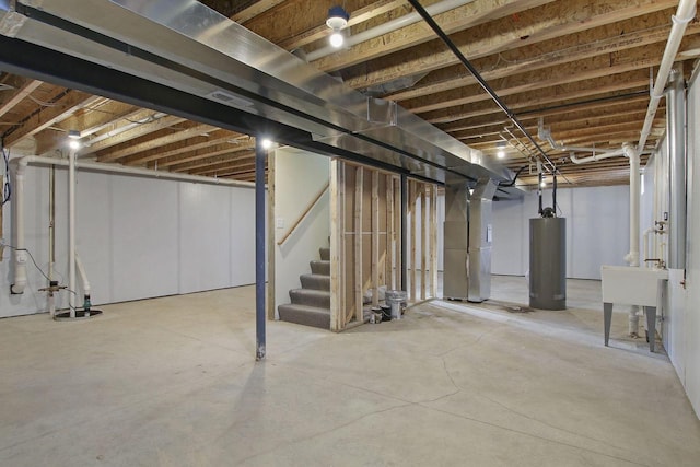 basement with water heater and sink