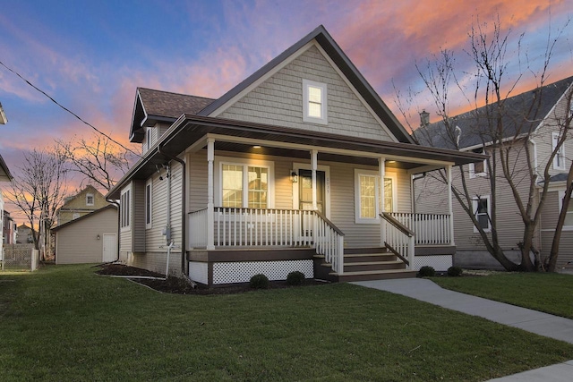 view of front of house with a lawn and a porch