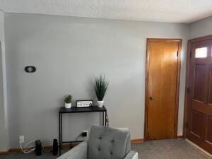 view of carpeted foyer