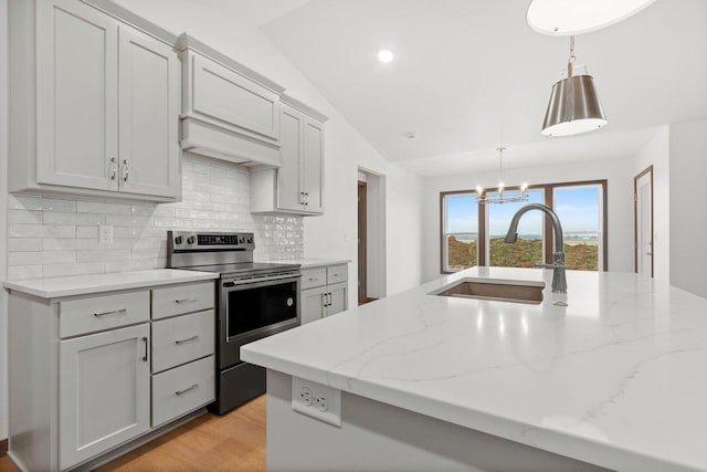 kitchen with tasteful backsplash, vaulted ceiling, sink, hanging light fixtures, and stainless steel electric range