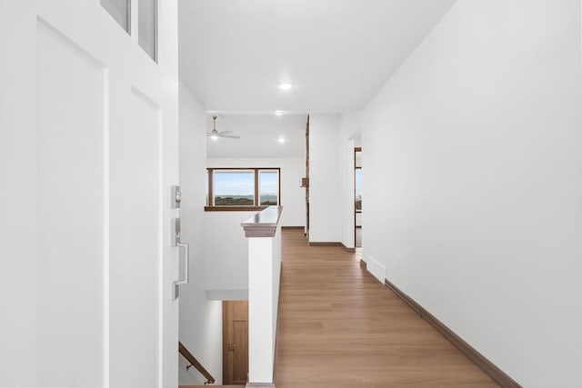 hallway with light wood-type flooring