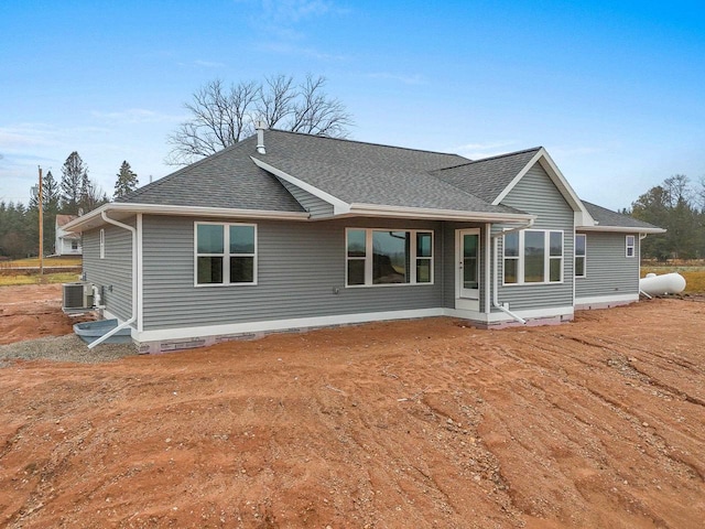 back of house featuring central AC unit