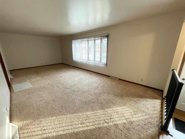 spare room with carpet