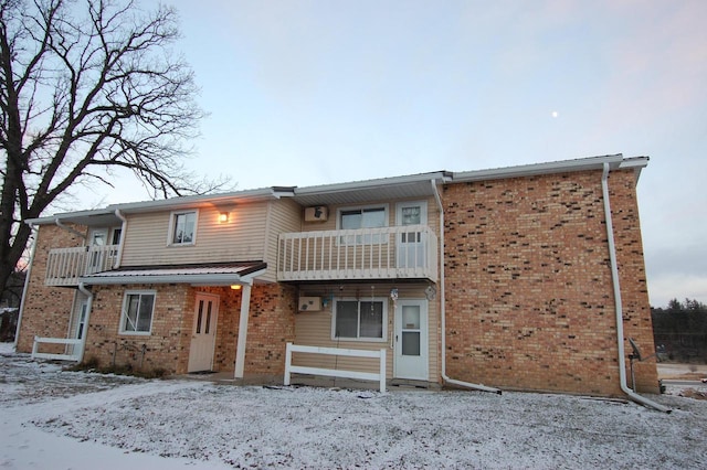 view of front of home with a balcony