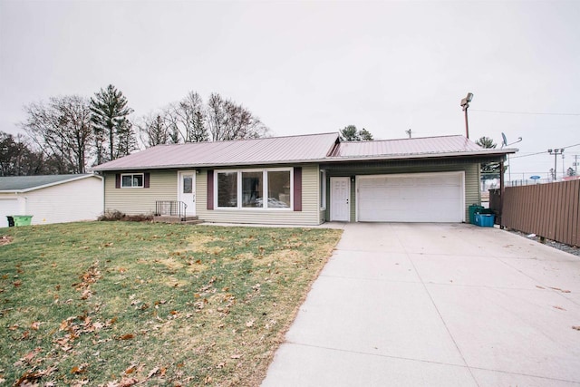 single story home with a front yard and a garage