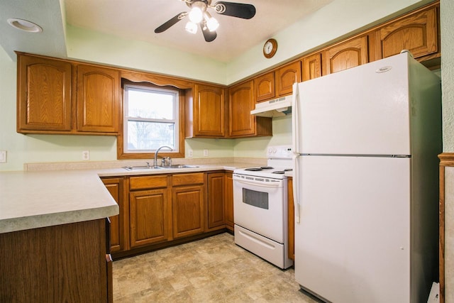 kitchen featuring ceiling fan, white appliances, and sink