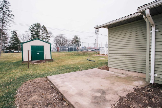 view of yard with a patio area and a storage unit