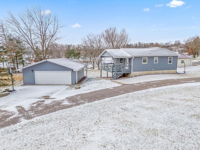 view of front of property with an outbuilding and a garage