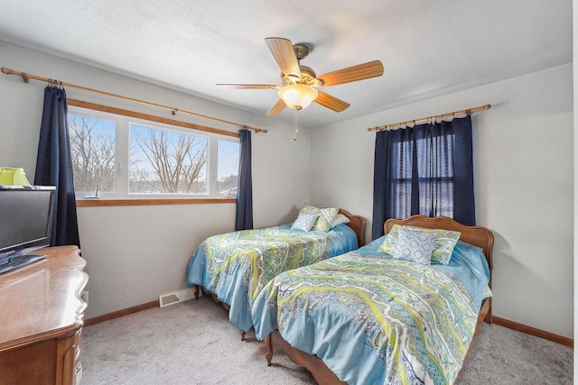 bedroom with light colored carpet and ceiling fan