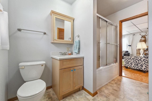 full bathroom with vanity, toilet, shower / bath combination with glass door, and wood-type flooring