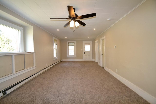 carpeted spare room featuring ceiling fan, a baseboard radiator, and ornamental molding