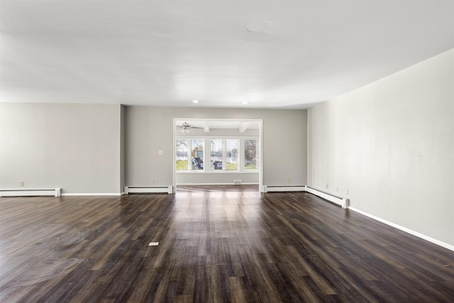 1001 Bay Shore Dr, Oshkosh, WI 54901 - unfurnished living room featuring a baseboard radiator and dark hardwood / wood-style floors
