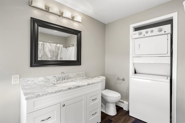 1001 Bay Shore Dr, Oshkosh, WI 54901 - bathroom with a baseboard radiator, wood-type flooring, stacked washer / drying machine, toilet, and vanity