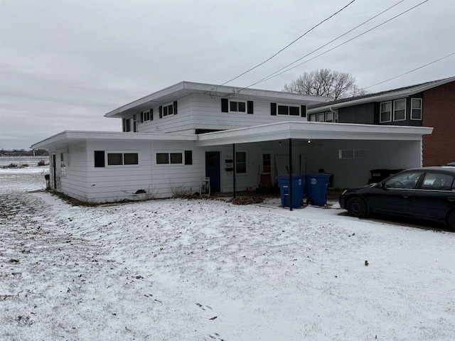 1001 Bay Shore Dr, Oshkosh, WI 54901 - snow covered property with a carport