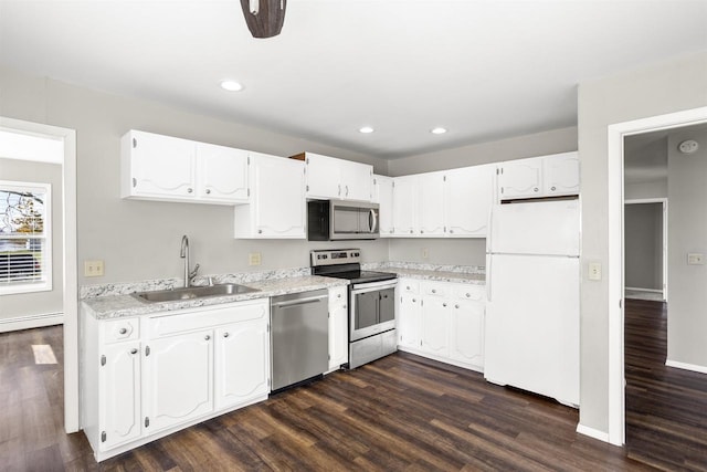 1001 Bay Shore Dr, Oshkosh, WI 54901 - kitchen with white cabinets, dark hardwood / wood-style flooring, stainless steel appliances, and sink