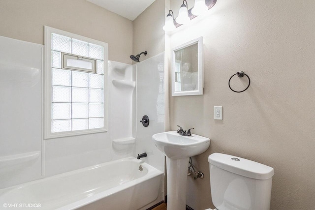 bathroom with toilet and shower / tub combination