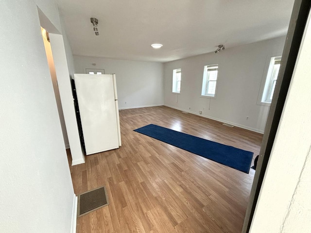 spare room featuring light hardwood / wood-style flooring