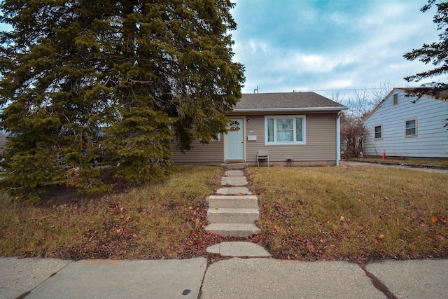 bungalow with a front lawn