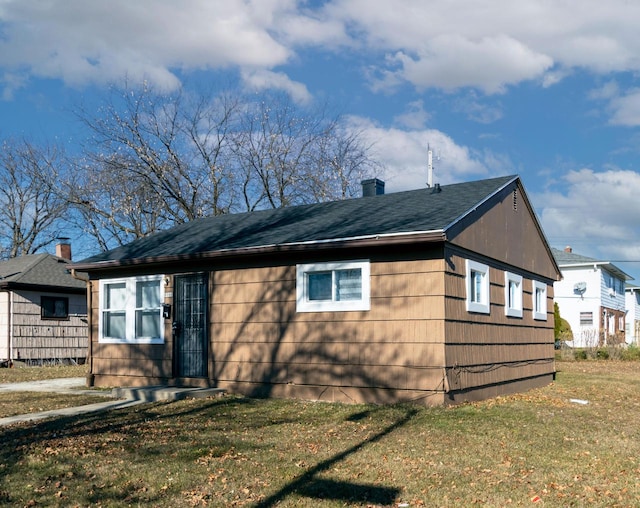 view of home's exterior with a yard