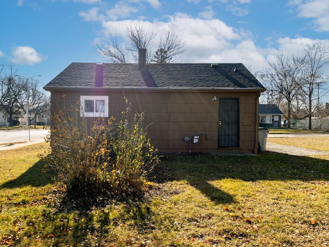 back of property with a lawn