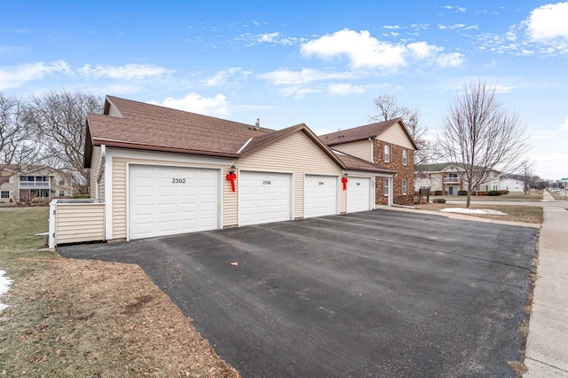 view of side of property with a garage