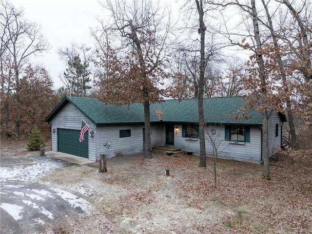 single story home featuring a garage