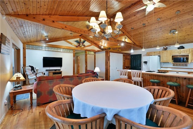 dining area with vaulted ceiling with beams, ceiling fan with notable chandelier, light hardwood / wood-style floors, and wooden ceiling