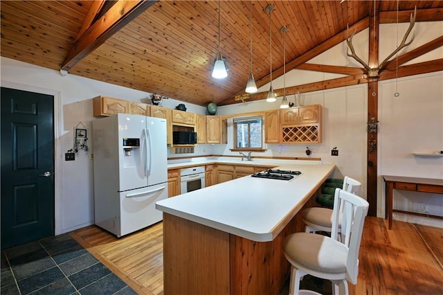 kitchen with white appliances, wooden ceiling, kitchen peninsula, wood-type flooring, and a breakfast bar area