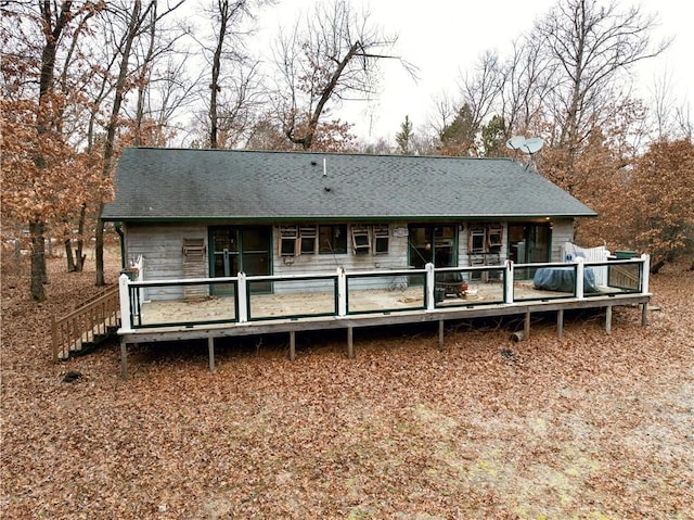 back of house featuring a deck