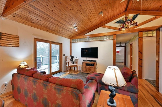 living room featuring lofted ceiling with beams, light hardwood / wood-style floors, and wood ceiling