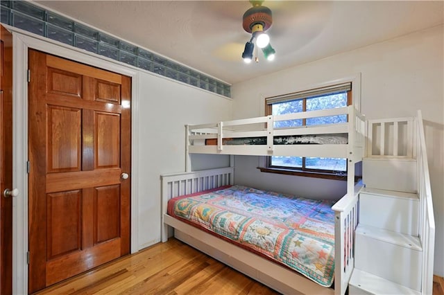 bedroom featuring ceiling fan and light hardwood / wood-style floors