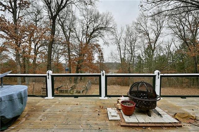 deck with an outdoor fire pit